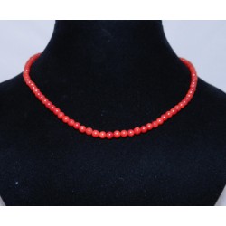 Бөмбөлөг хэлбэртэй засагдсан улаан хүрэн шүрэн зүүлт.